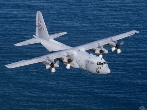 A C-130E from the 2nd Airlift Squadron, Pope AFB, NC.  Flies over the Atlantic Ocean.