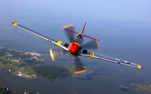 OVER VIRGINA -- Ed Shipley flies a P-51 Mustang in a heritage flight during an air show at Langley A