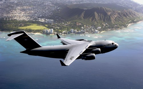 HICKAM AIR FORCE BASE, HAWAII (AFPN) -- The first Hawaii-based C-17 Globemaster III flies past Diamo