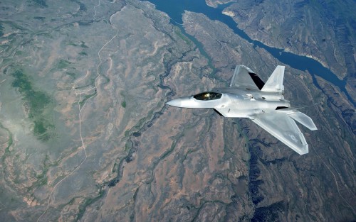 060530-F-4883S-090A U.S. Air Force F-22A Raptor aircraft flies over Colorado after in-flight refueli
