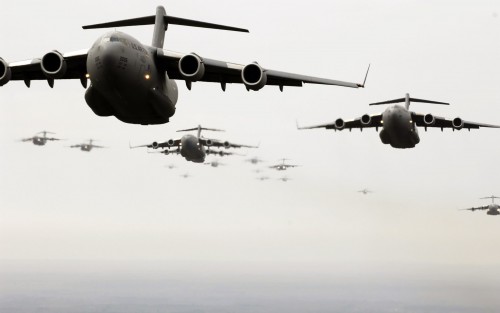 Several C-17 Globemaster IIIs fly as part of a 20-ship formation Dec. 21 over South Carolina. The C-