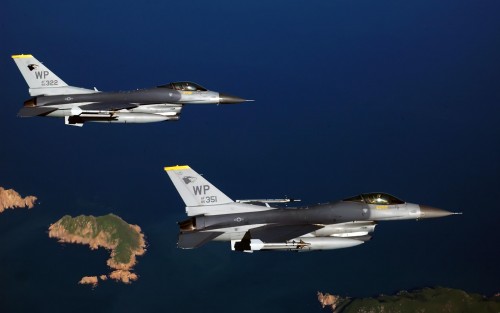 060815-F-2171A-017      Two F-16 Fighting Falcon aircraft from the 80th Fighter Squadron fly to the 
