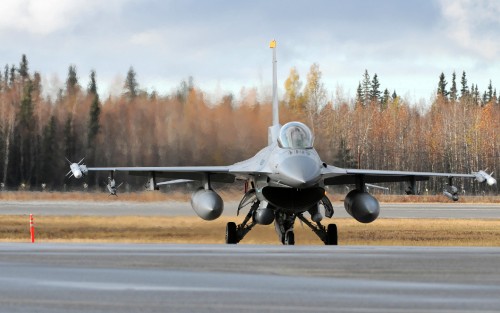 An F-16 Fighting Falcon from Misawa Air Base, Japan, goes over final flight checks prior to take off