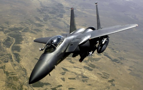 An Air Force F-15E Strike Eagle aircraft returns to the fight after receiving fuel from a KC-135R St