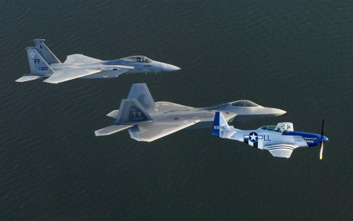 OVER ATLANTIC OCEAN (AFPN) - An F-15 Eagle, F/A-22 Raptor and P-51 Mustang train for heritage flight