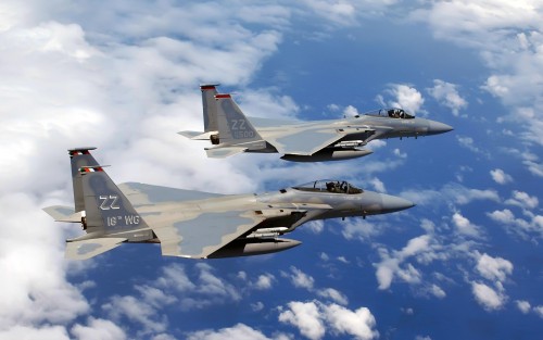 KADENA AIR BASE, Japan -- A formation of F-15C Eagles flies over Okinawa following a joint bi-latera