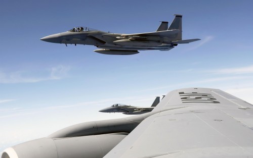 An F-15 Eagle flies alongside a KC-135 Stratotanker during Exercise Valiant Shield Aug. 9 at Anderse